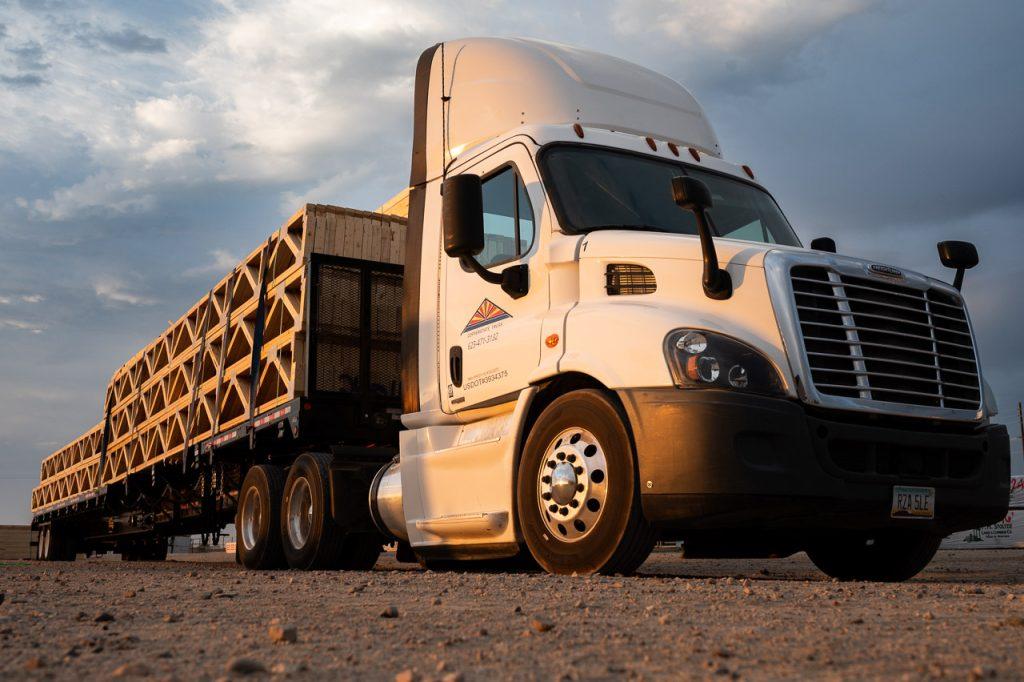 Copperstate Truss delivery truck loaded with roof trusses in Buckeye Arizona