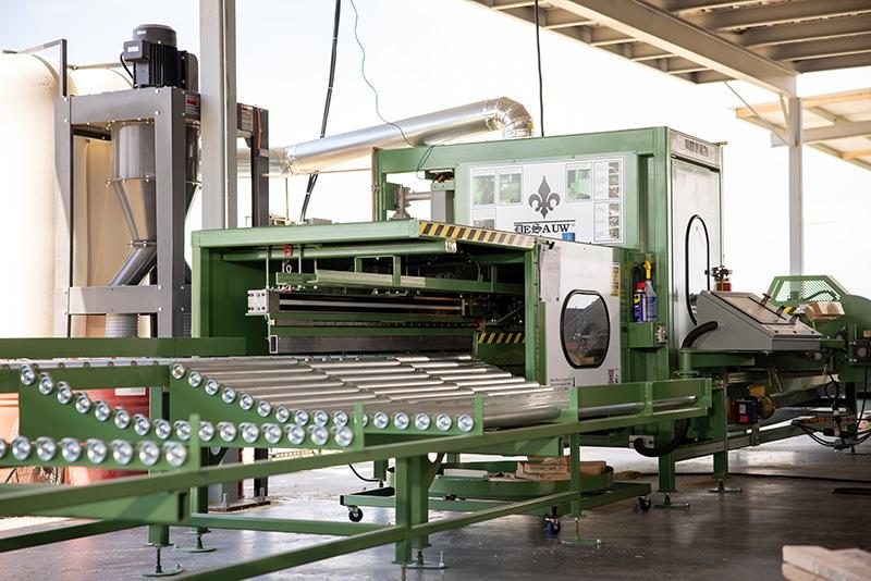 Shiny new Monet Linear Saw installed at Copperstate Truss manufacturing facility.